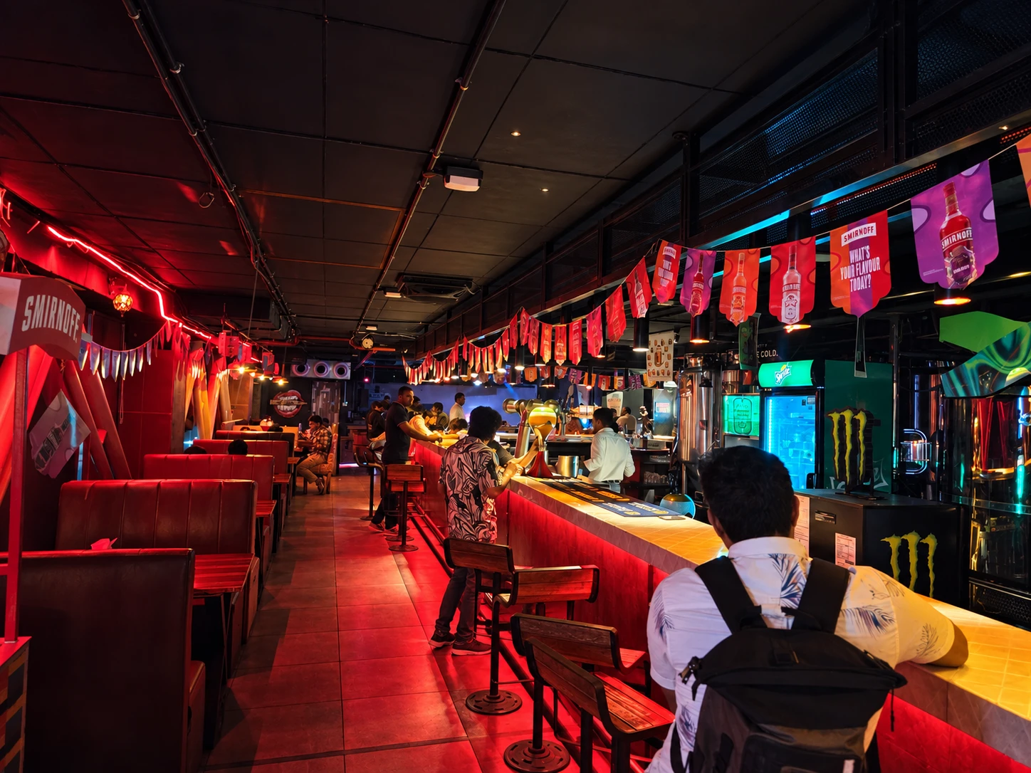 Brewery-side seating and the glowing red bar.